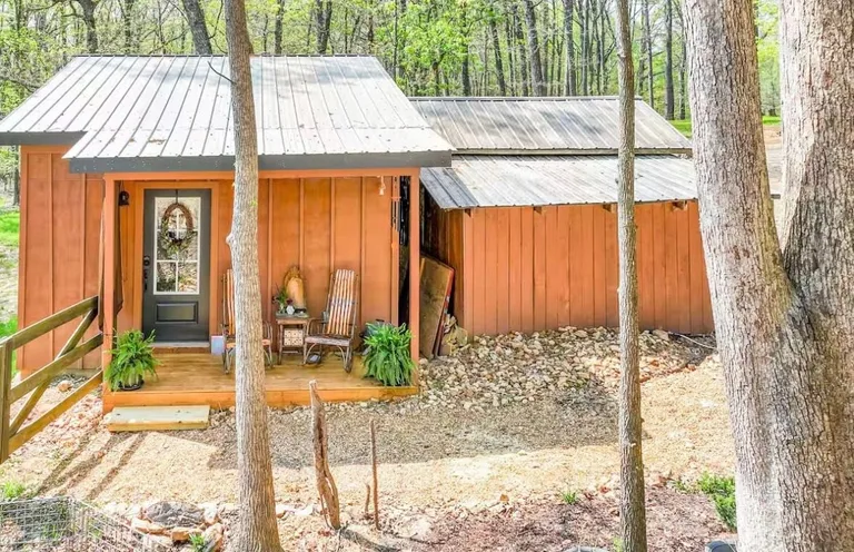 The cabin tucked into the trees