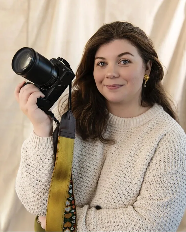 Catherine Feddon holding her camera