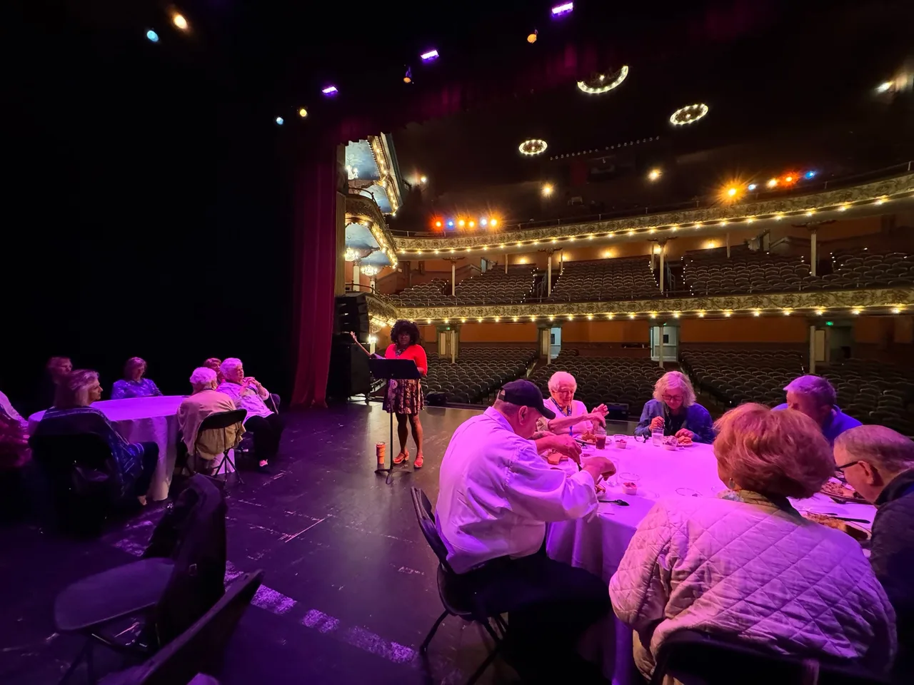 A dinner-style event on the Piedmont Grand Opera House stage